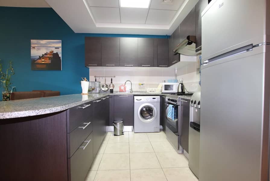 3 Fully Equipped Kitchen |Pool View | Middle Unit |1BR+Blcny