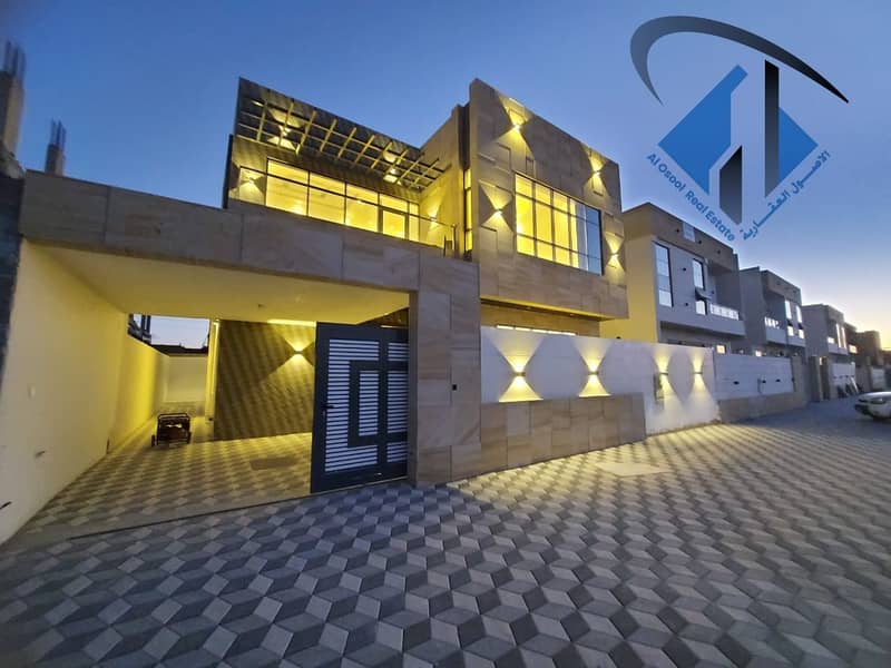 For sale, a modern villa in Ajman Corner, excellent location, on a street, very excellent finishing