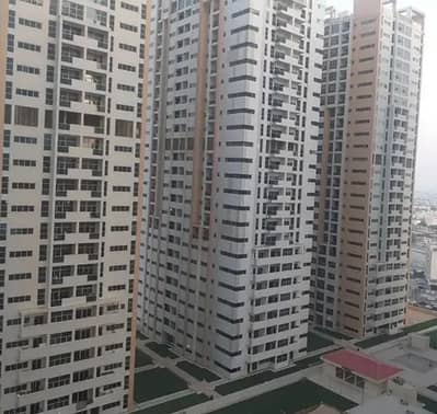 SPACIOUS PARTIAL SEA VIEW TWO BEDROOM PLUS HALL APARTMENT WITH BUILDIN WARDROBS STORE ROOM, LAUNDRY ROOM, PARKING THREE BATHROOMS, OPEN KITCHEN AND BALCONY IN AJMAN ONE TOWERS FOR RENT ON 35,000.00 ONLY.