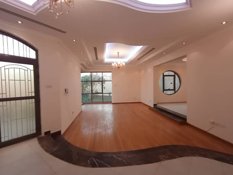 Super Lux luxury villa for rent in Al Warqaa consists of (3 master bedrooms + large hall + large kitchen + large external extension + maid room + laundry room + dining room + ironing room + large planted garden + covered parking) . . . there are also other