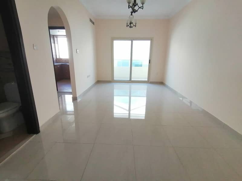 Like Brand new 2bhk apartment with balcony 2 bathrooms Open view covered parking New Muwaileh sharja just 38k