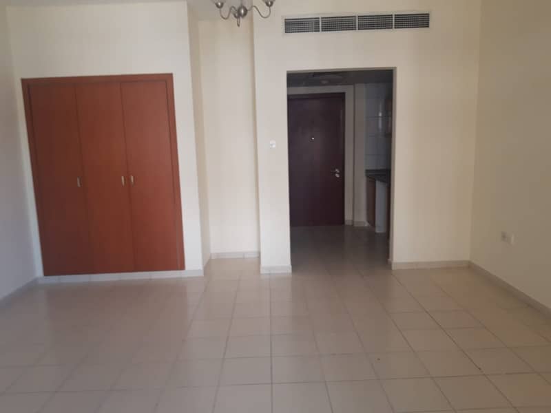 Stunning Studio with Balcony for Sale in Emirates Cluster 220K net to the Landlord