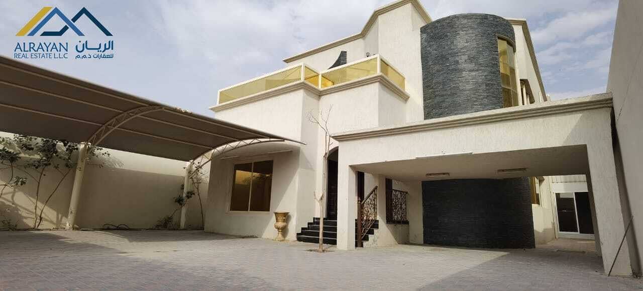 A clean two-storey villa with split air conditioning for rent in Al Rawda 2 near Al Hamidiyah Police Station