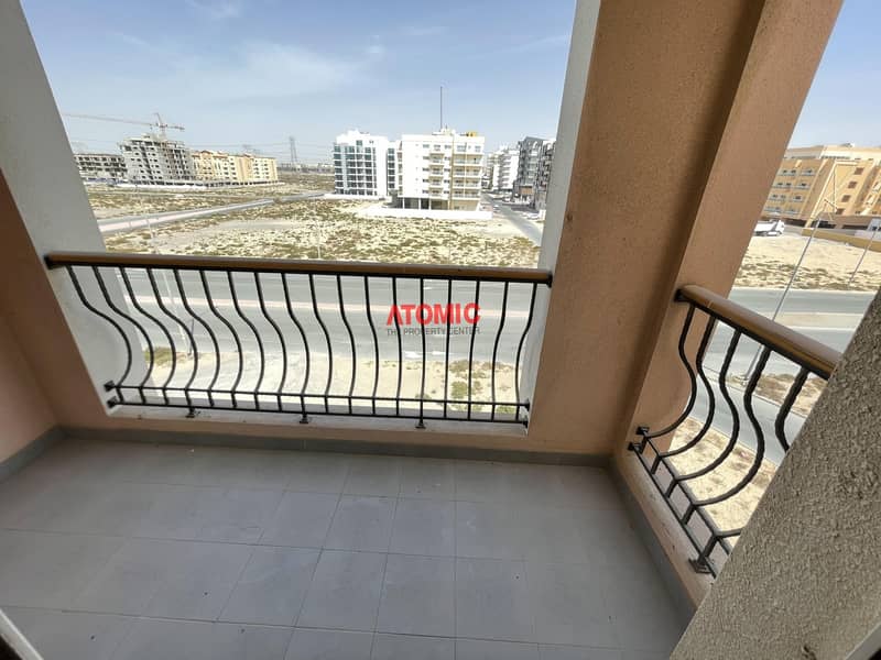 One month free large 2 bedroom closed kitchen with balcony in Warsan4 =01