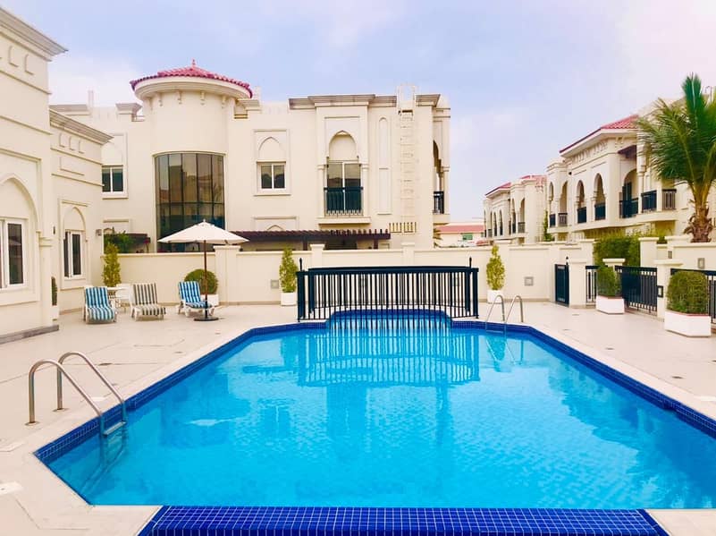 Spacious 5 bedroom villa with shared pool/gym umm suqiem 1