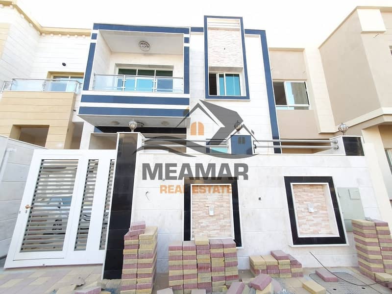Modern villa with 5 bedrooms on the main road in Al yasmeen area .