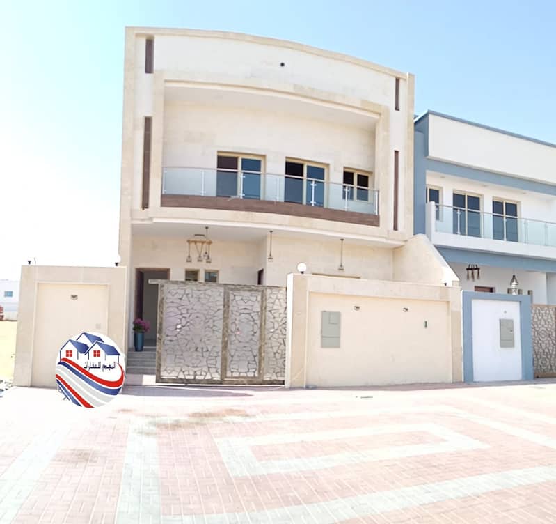 A stone face villa for sale, personal finishing, at an excellent price, in Ajman, located directly on the Sheikh Zayed program