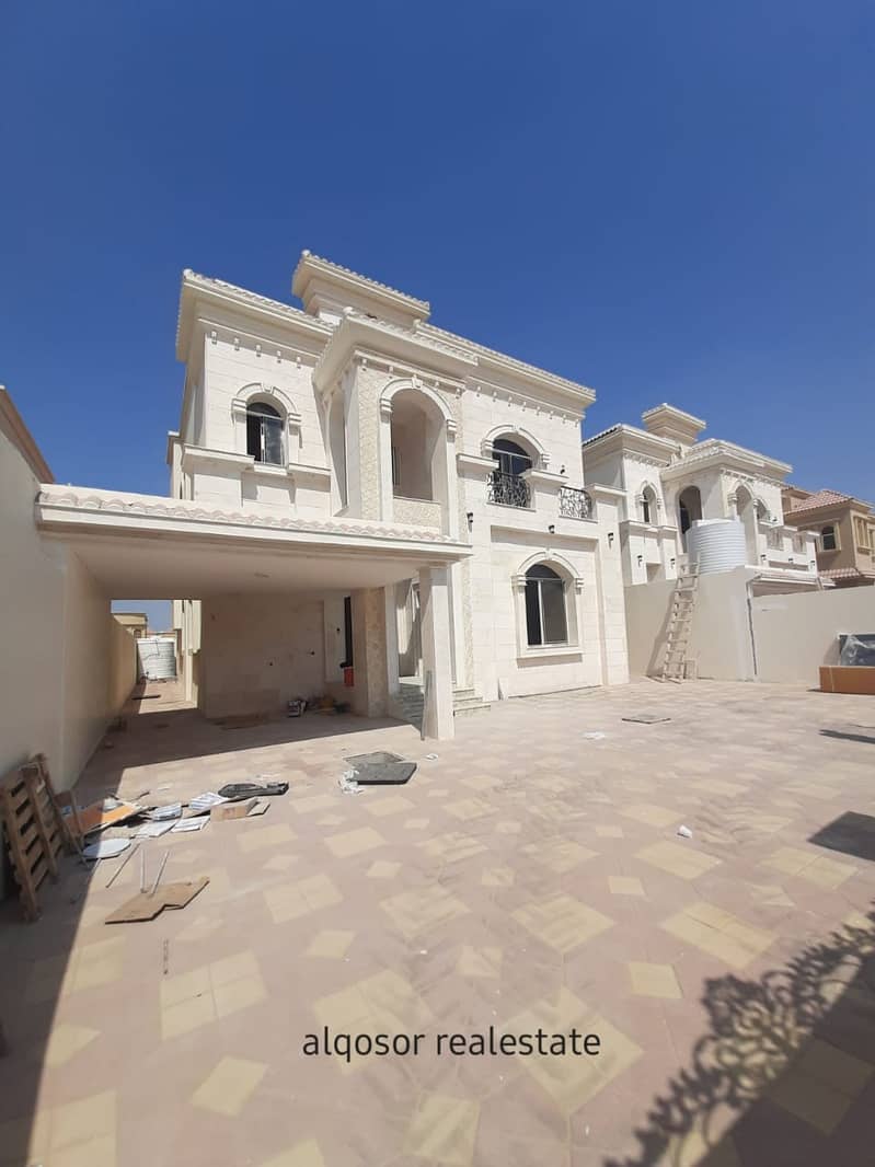 Villa for sale in Ajman, Al-Mowaihat area, facing a stone, Arabic design, various finishes, next to all services, with the possibility of easy bank financing