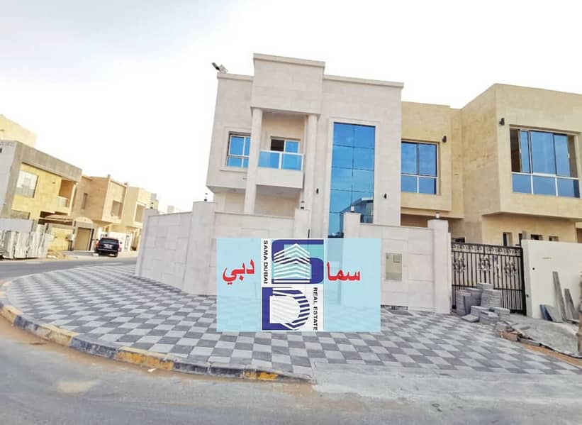 Villa for sale in Ajman, Jasmine area, two floors, facing stone, modern super deluxe design, with the possibility of easy bank financing