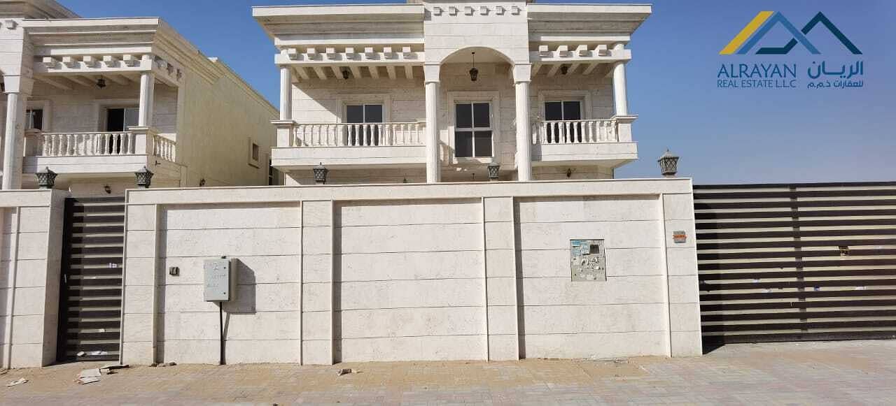 New villa with stone facade, large areas and central air conditioning in Al Mowaihat 1 near Al Tallah Street with the possibility of easy bank financing