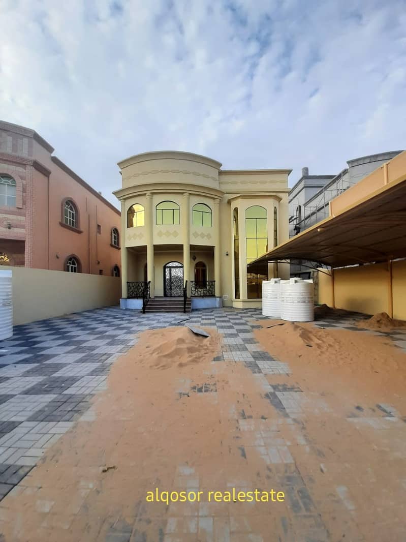 Villa for sale in Ajman, the Rawda area, two floors, Arabic design, various finishes, very excellent, close to the services