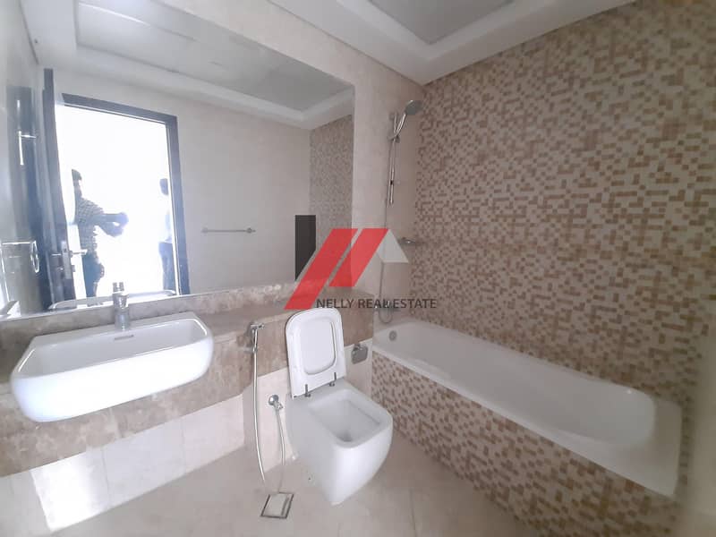 29 1 Month free Spacious 1 BHK With 2 Baths Master Bedroom Gym Pool Parking Only for 33k 4/6 chqs