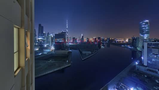 1BR on high floor | Lake and Burj Khalifa View | Balcony | Parking | Pool | Gym