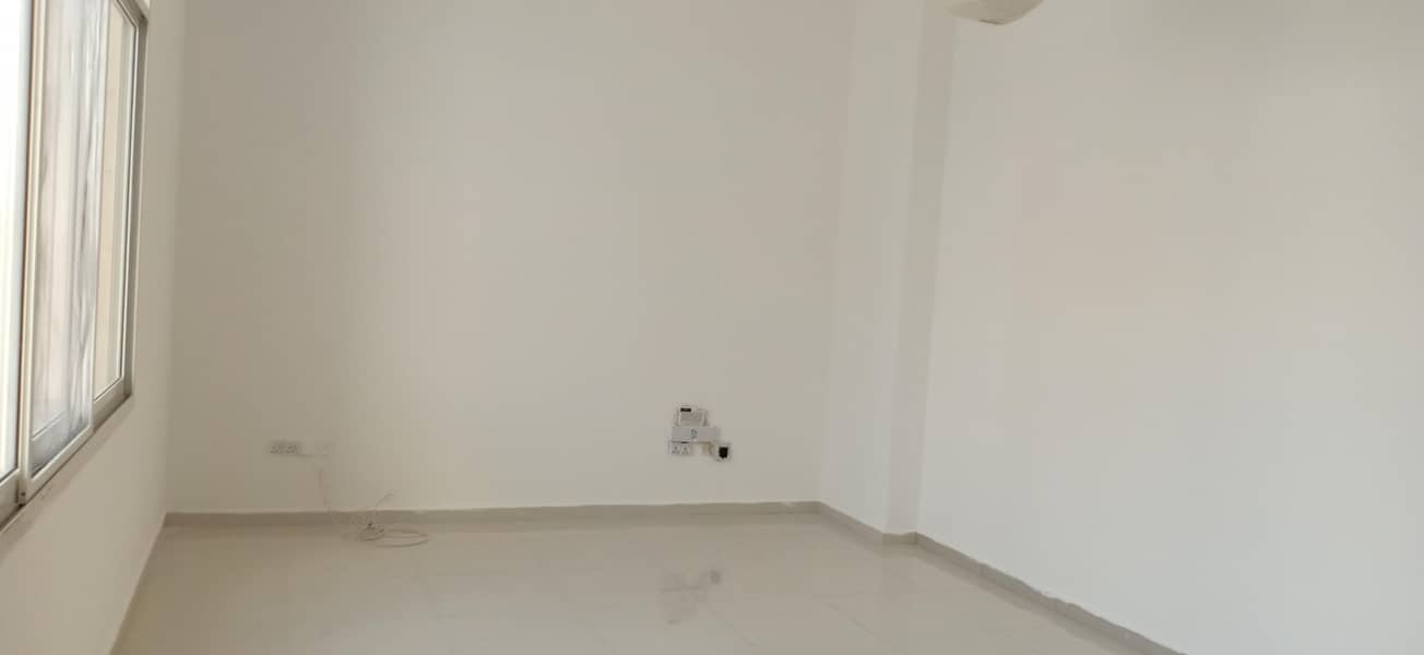 Two wonderful rooms and a hall for rent in Khalifa City with a back space