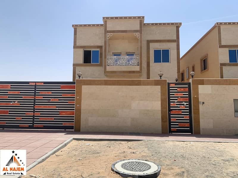 For sale, villa with luxurious designs and finishes, with a modern stone facade, and ready to move in.