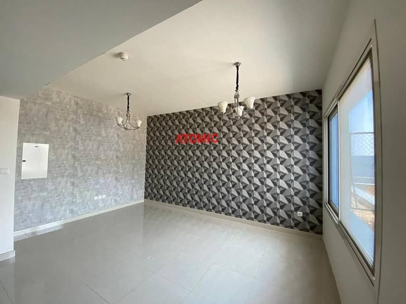10 Amazing offer large studio with balcony pool view in Warsan4