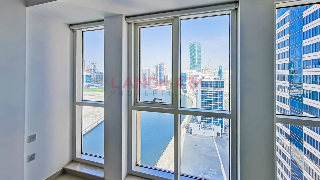 25 1BR on high floor | Lake and Burj Khalifa View | Balcony | Parking | Pool | Gym
