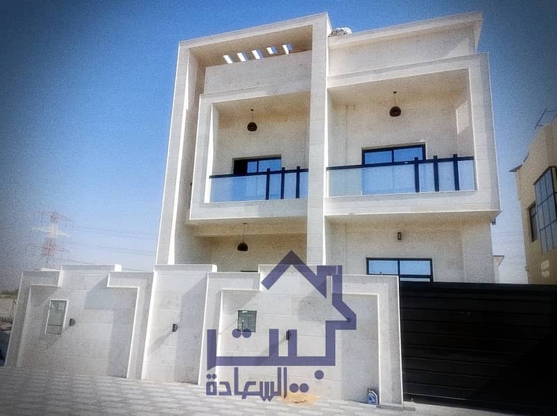 Villa for sale in the emirate of Ajman, Jasmine area, villa with stone face finishing, super deluxe, modern design, villa without down payment, on a street directly