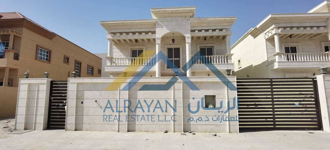 New villa with stone facade, large areas and central air conditioning in Al Mowaihat 1 near Al Tallah Street with the possibility of easy bank financing