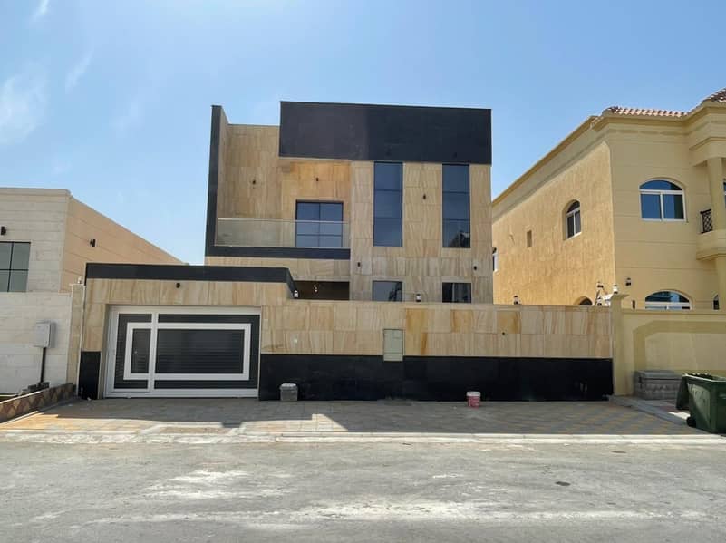 Villa for sale, personal finishing, excellent price Ajman, close to the main street, a large building area,