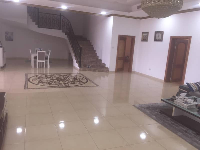 Super Lux Villa for sale in Al Warqa'a (8 master bedrooms + 2 halls + large council + large kitchen + maid’s room + driver’s room + dining room + laundry room)