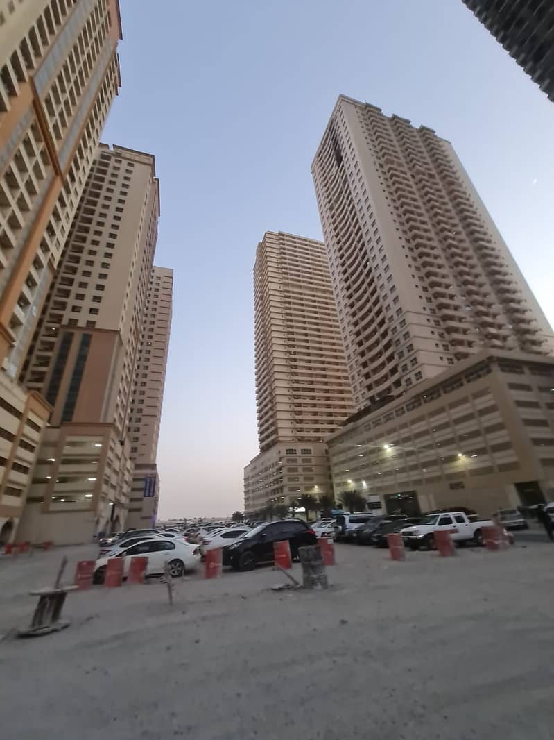 BEST DEAL. . . SPACIOUS TWO BEDROOM HALL WITH PARKING IN LAVENDER TOWER AJMAN