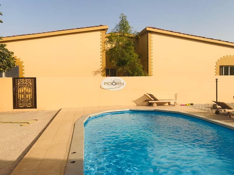 Excellent 3 bedroom plus maid single storey villa with shared pool in Umm Suqeim 2