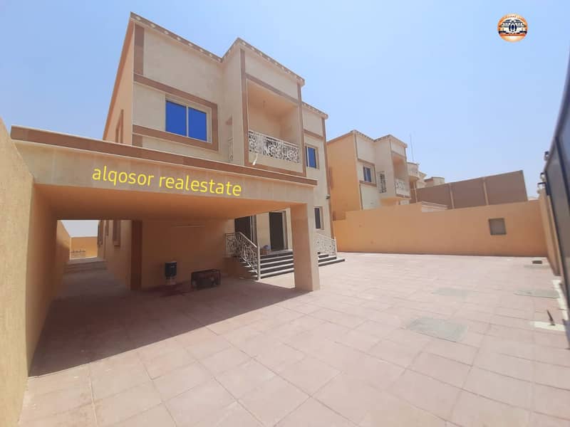 Villa in Ajman, Al Mowaihat, two floors, facing stone, design of various finishes, with the possibility of easy bank financing