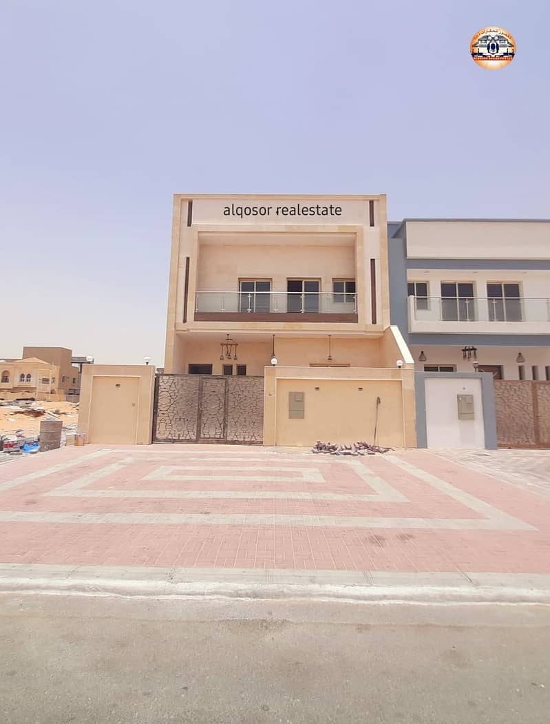 Modern design villa in an upscale and quiet area close to Sheikh Mohammed bin Zayed Street in Ajman, Al Helio area, two floors, a stone face, on a str