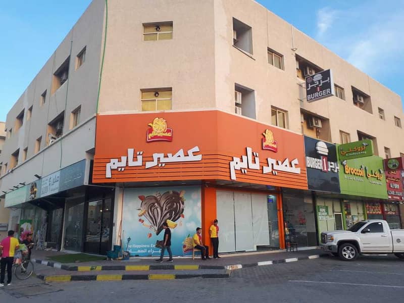 Building for sale in a very special location in Al Rawda directly on Sheikh Ammar Street, a corner of two streets, with a very special income