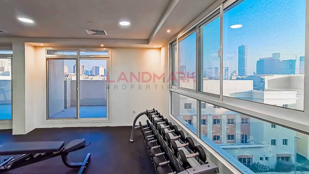 9 HOT | New Studio | Balcony facing on street | Parking | Pool | Gym | Next to gate 2 in JVC