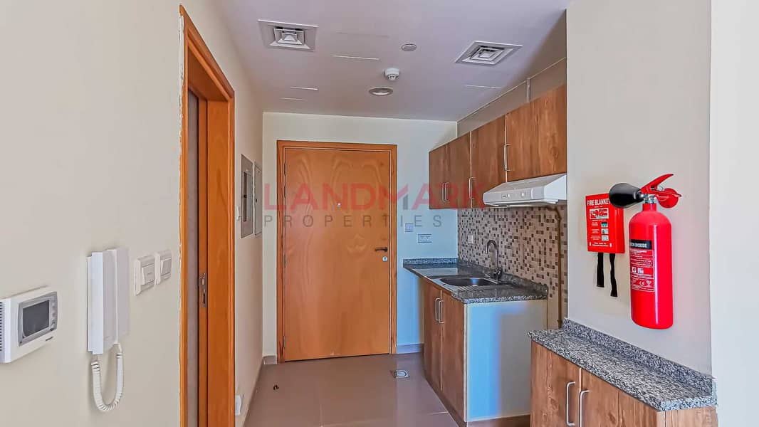 15 HOT | New Studio | Balcony facing on street | Parking | Pool | Gym | Next to gate 2 in JVC