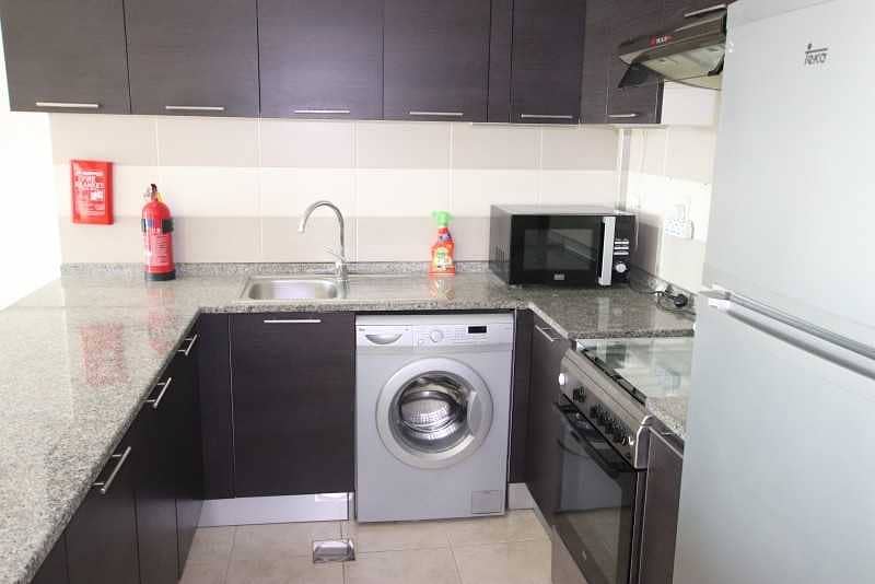 2 Fully Equipped Kitchen |Pool View | Middle Unit |1BR+Blcny