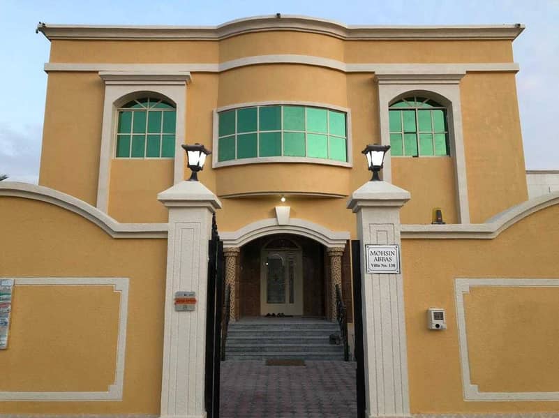 Luxurious villa for sale with electricity and water in Al Mowaihat 2 at an excellent price on two streets near all services, hypermarkets and shopping centers