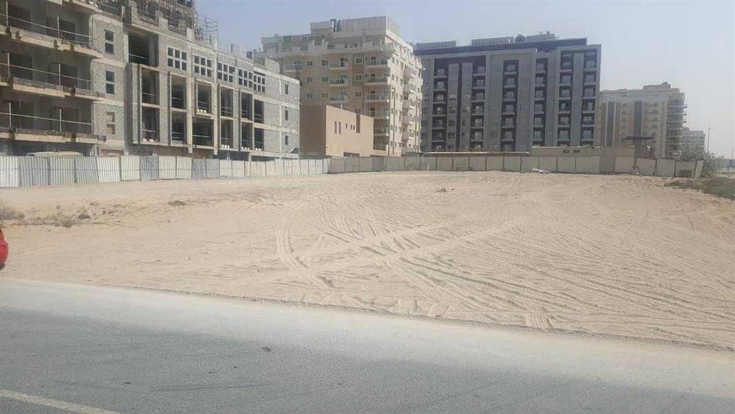 plot for sale in international city phase 1&2 main road