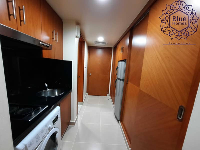 7 Dewa Free Studio with Balcony 1 Month free with Gym pool & parking with Kitchen Appliances Close To Fahidi Metro