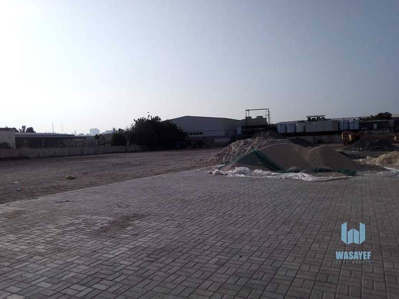 6 HUGE PLOT WITH A LARGE WAREHOUSE FOR RENT /10AED PER SQFT. .