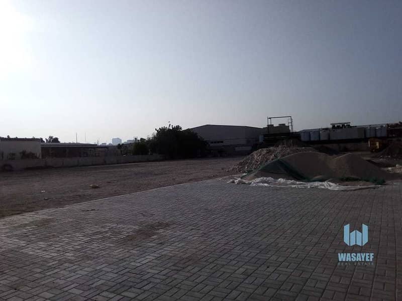 9 HUGE PLOT WITH A LARGE WAREHOUSE FOR RENT /10AED PER SQFT. .