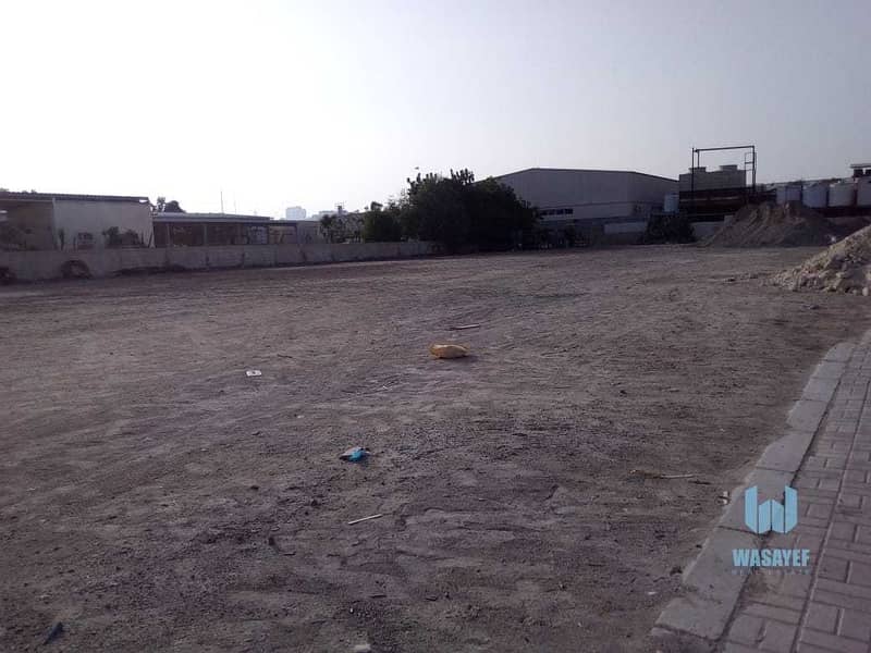 10 HUGE PLOT WITH A LARGE WAREHOUSE FOR RENT /10AED PER SQFT. .