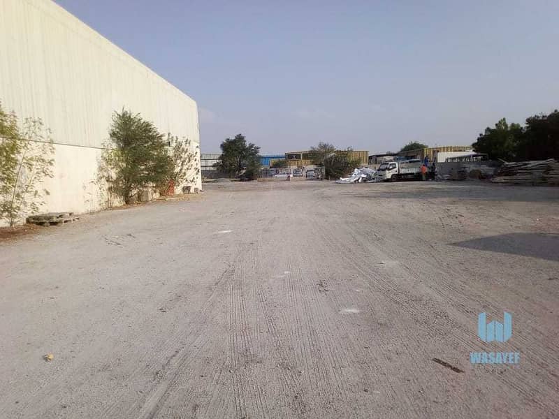 11 HUGE PLOT WITH A LARGE WAREHOUSE FOR RENT /10AED PER SQFT. .