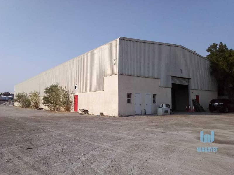 12 HUGE PLOT WITH A LARGE WAREHOUSE FOR RENT /10AED PER SQFT. .
