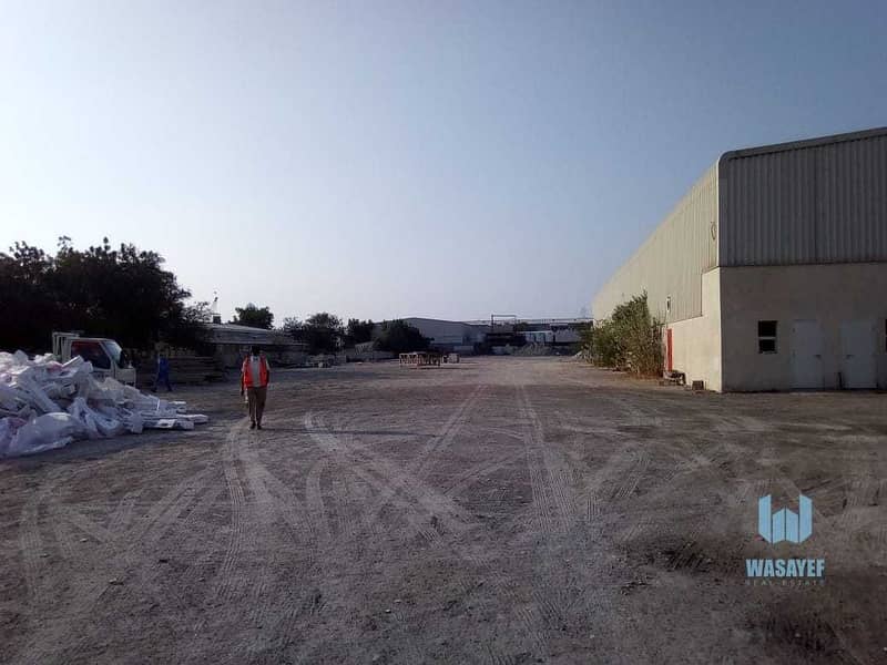 15 HUGE PLOT WITH A LARGE WAREHOUSE FOR RENT /10AED PER SQFT. .