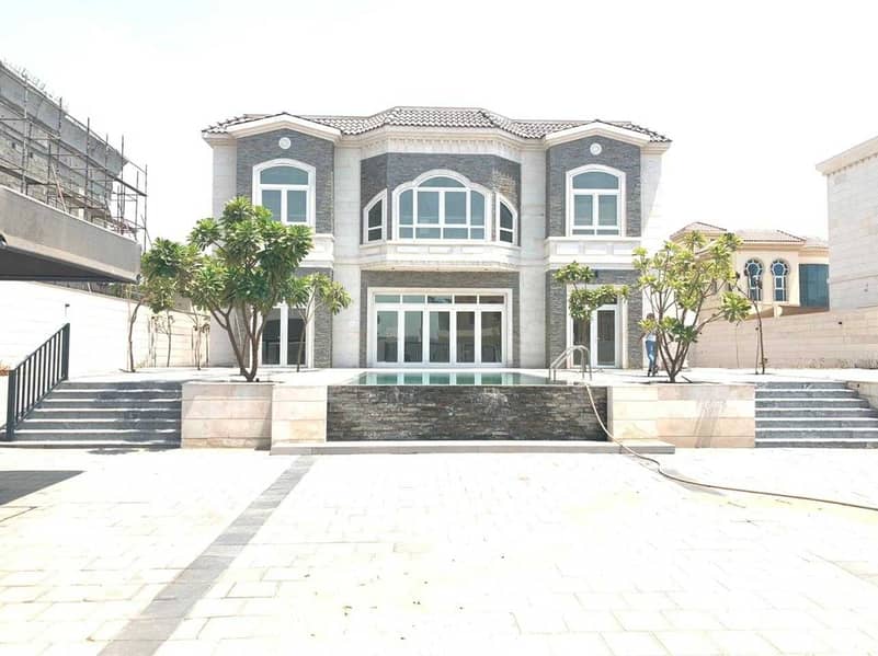 Super Luxury villa for rent in Al Khawaneej (4 master bedrooms +2  hall +2  majlis + large kitchen+ dining room+ parking + private swimming pool)
