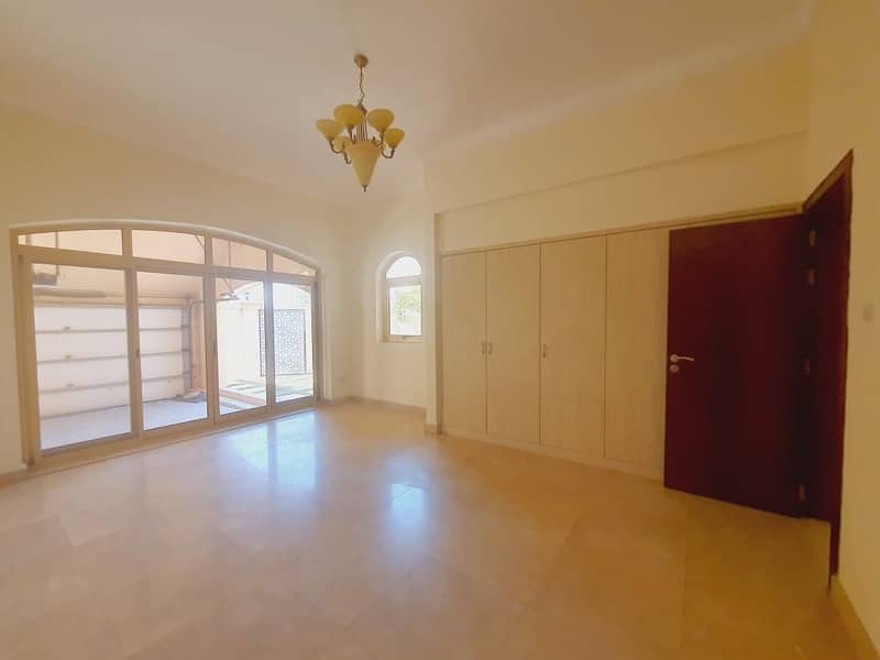 12 Very spacious 5bhk compound villa with study & shared pool+gym in umm suqaim 1 rent is 240k