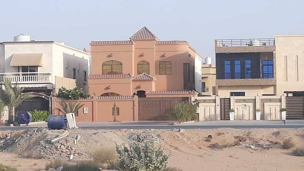 Villa for sale in Ajman with electricity and water on Qar Street freehold