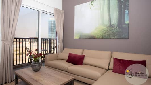 2 Bedroom Flat for Rent in Jumeirah Village Circle (JVC), Dubai - Living room couch 2 Bedroom Flat for Rent in Jumeirah Village Circle (JVC), Dubai - Living room couch