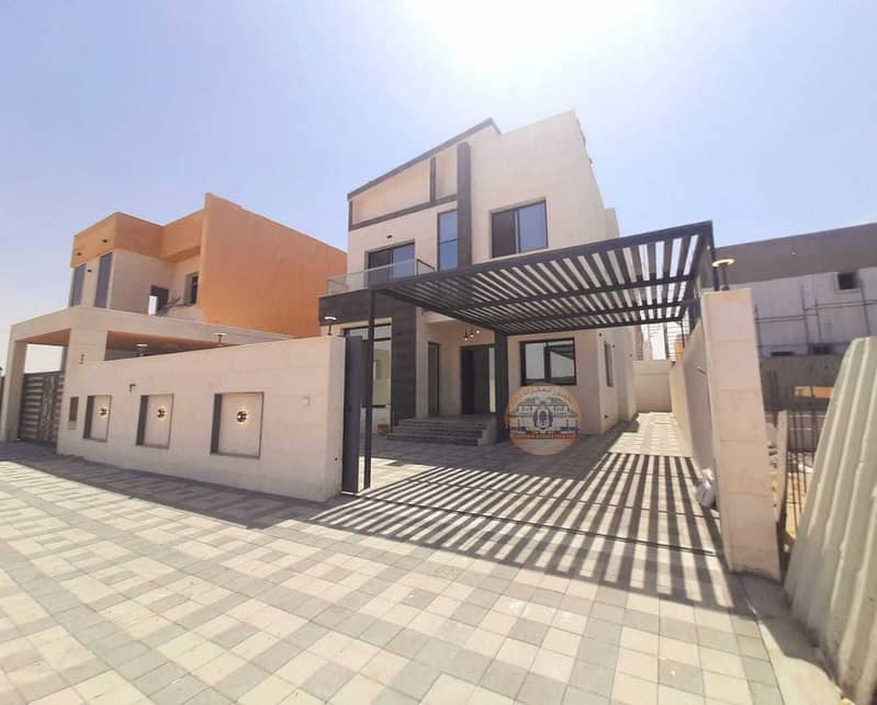 The location of the villa in Ajman, the Al-Amrah area, two floors, a stone face, a central air conditioning, a ready-made machine, a modern super delu