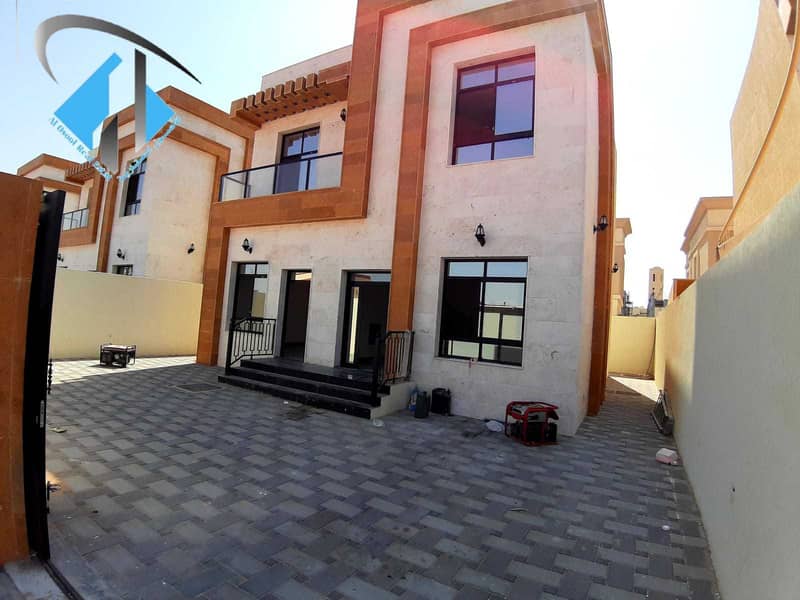 For sale villa with a stone face, central air conditioning, high quality finishes, two floors, freehold for all nationalities, on Mohammed bin Zayed