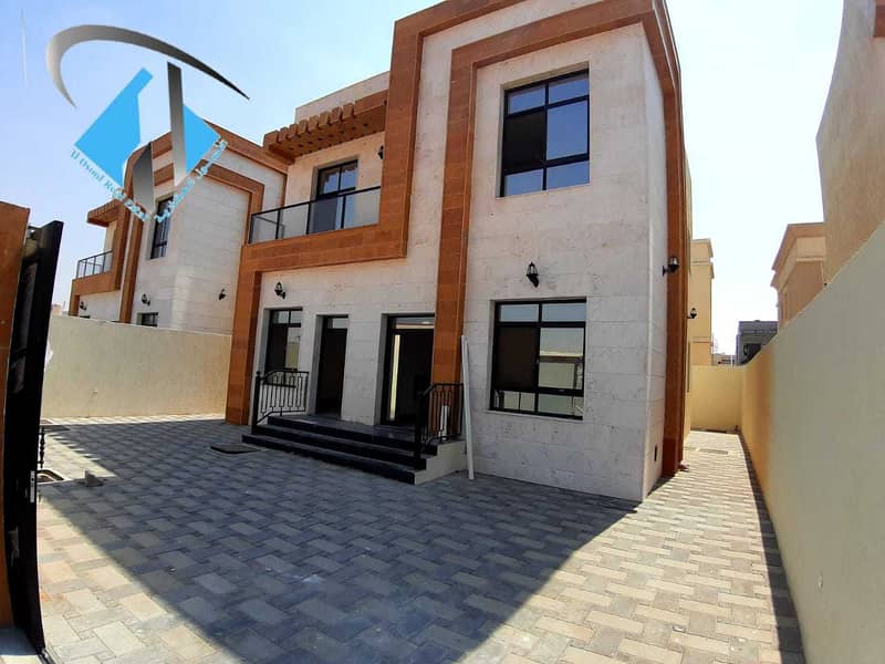 For sale villa with a stone face, central air conditioning, high quality finishes, two floors, freehold for all nationalities, on Mohammed bin Zayed