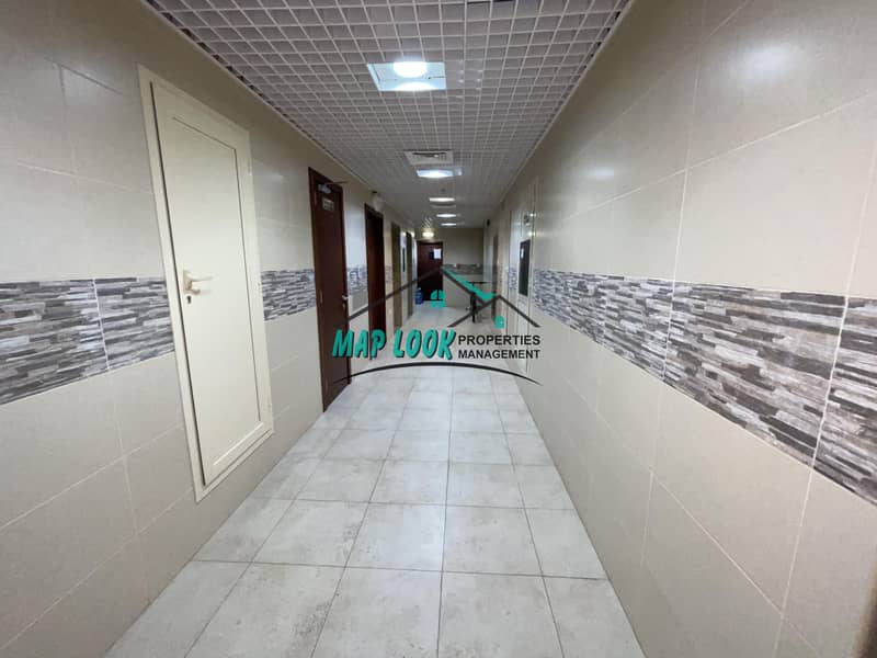 Newly 2 bedroom with parking 60k both room wardrobes centralized a. c located al  nahyan